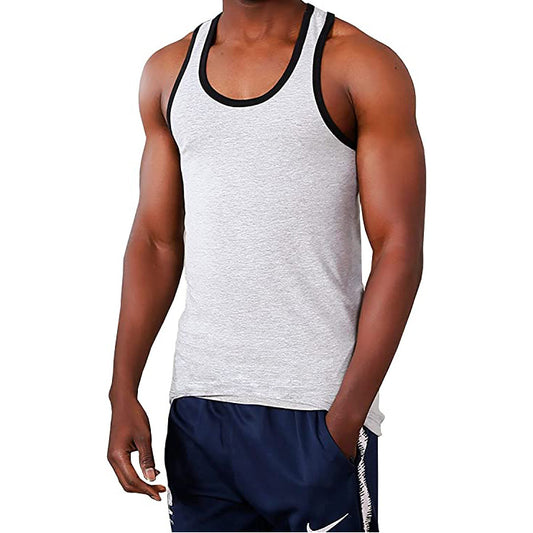 Person wearing a gray tank top with black trim and navy shorts on a white background