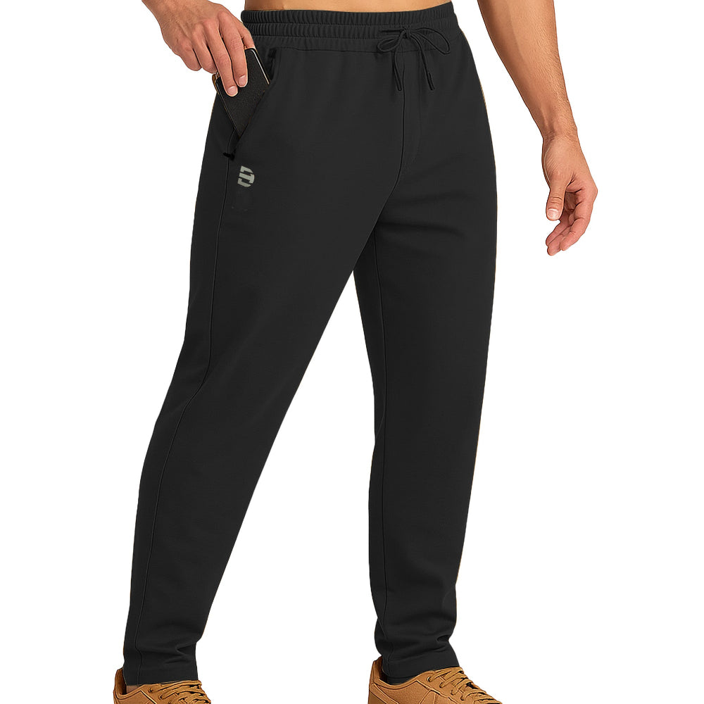 Black jogger pants worn by a person on a white background