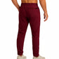 Maroon sweatpants worn by a person on a white background